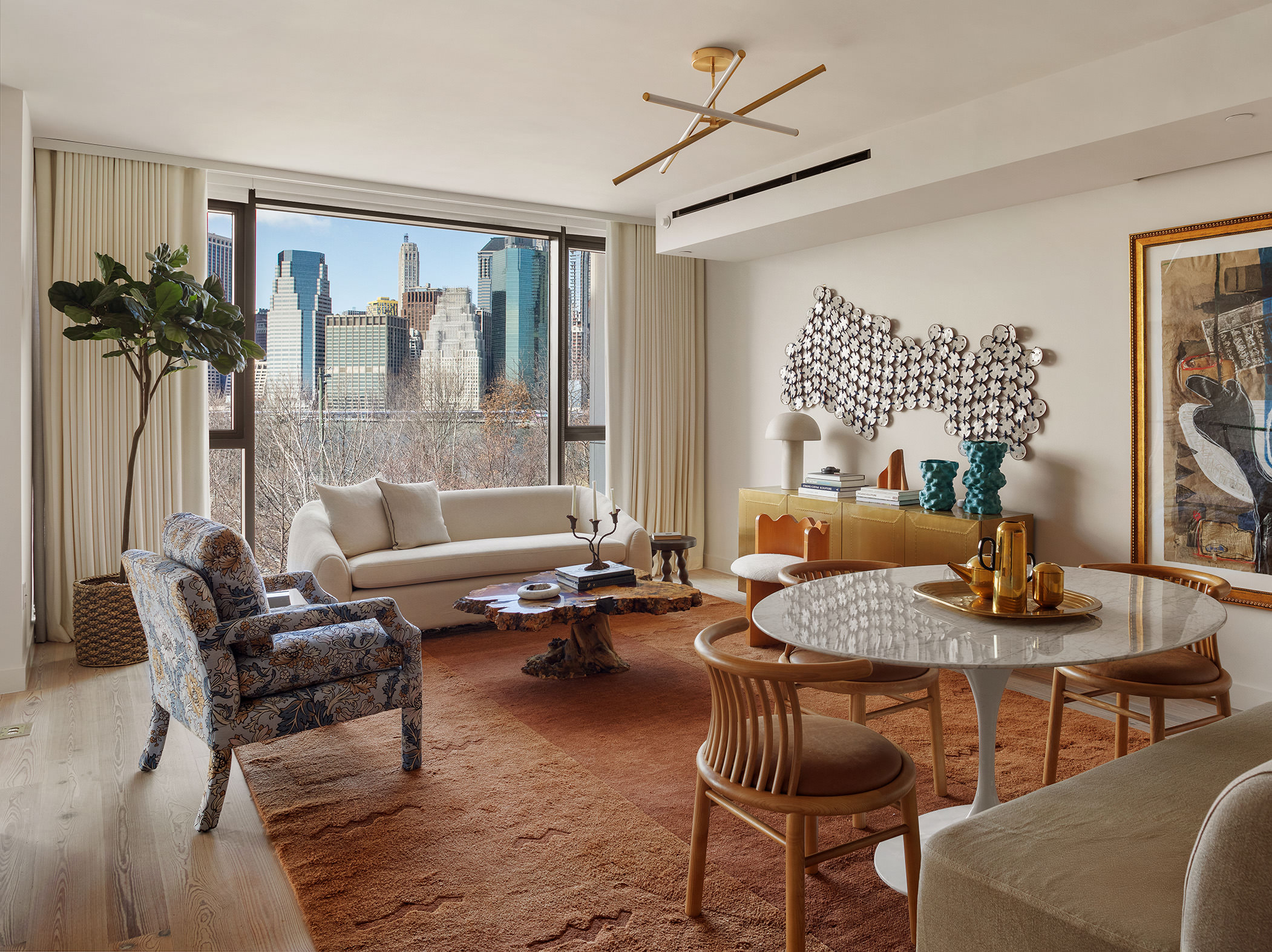 90 Furman Street, Unit N411 Brooklyn, NY 11201 - Photo 5 of 29 a living room with furniture and a potted plant