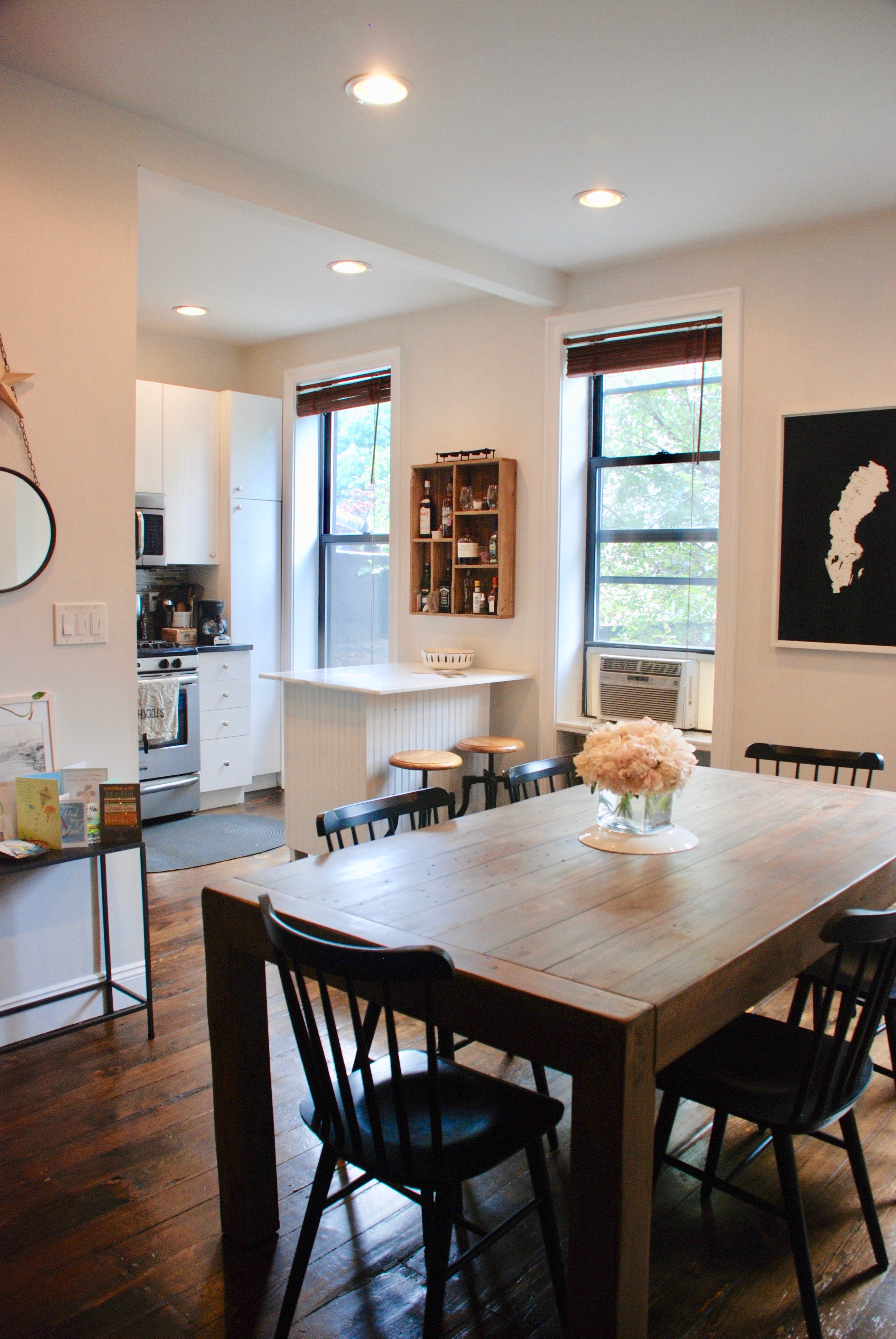 511 Clinton Street, Unit 3 Brooklyn, NY 11231 - Photo 2 of 12 a view of a dining room and livingroom with furniture wooden floor and a rug