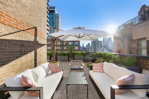 swimming pool view with a seating space