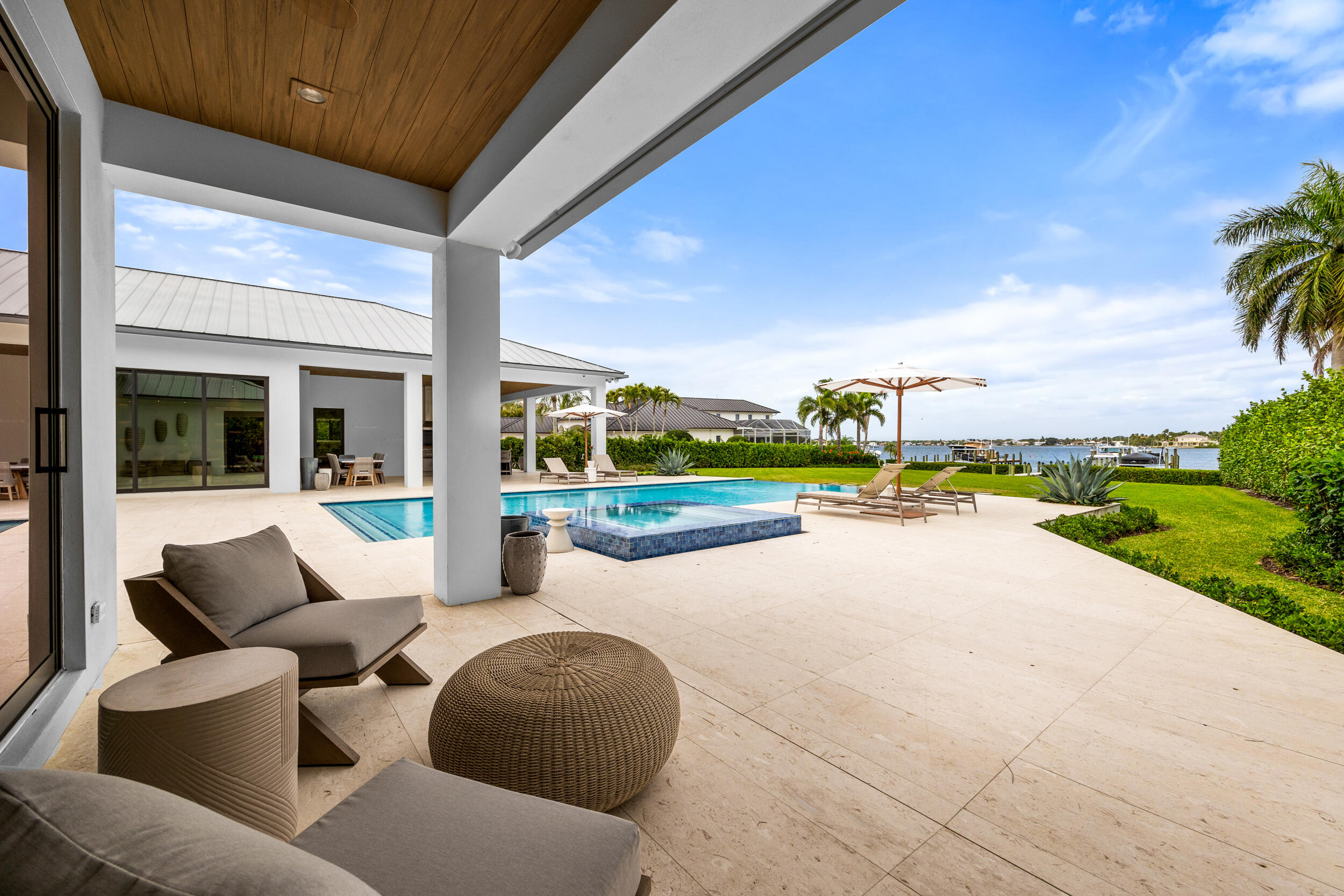 5695 Pennock Point Road Jupiter, FL 33458 - Photo 60 of 77 a view of swimming pool with outdoor seating and plants