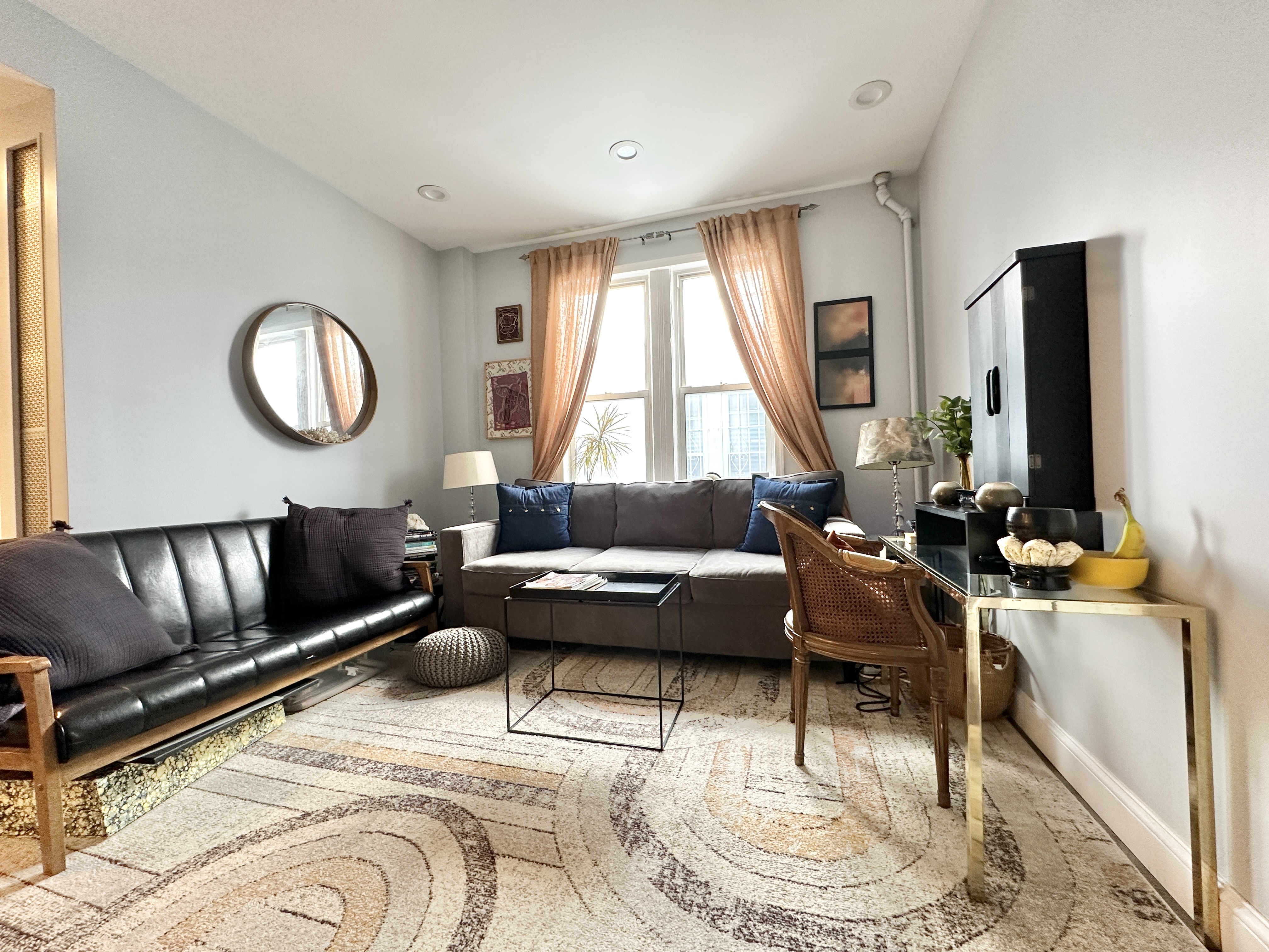 172 Minna Street, Unit 2 Brooklyn, NY 11218 - Photo 2 of 9 a living room with furniture and a large window