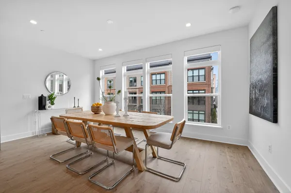 a view of a dining room with furniture window and wooden floor