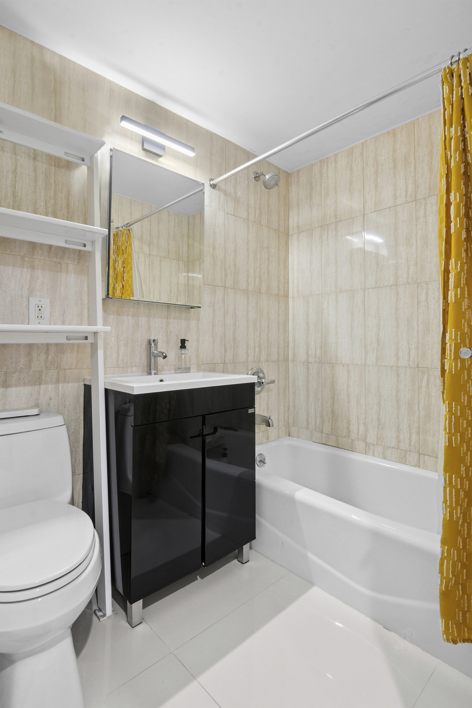 145 Kenilworth Place, Unit 2A Brooklyn, NY 11210 - Photo 6 of 7 a bathroom with a sink toilet and shower