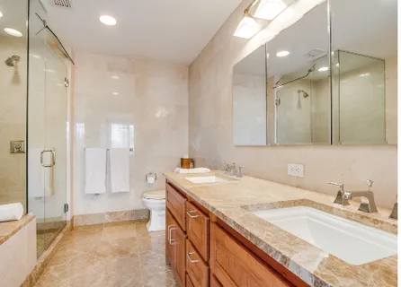 a bathroom with a granite countertop sink mirror and double