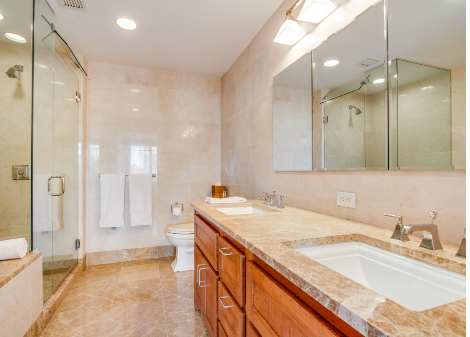 45 Park Avenue, Unit 2101 Manhattan, NY 10016 - Photo 6 of 10 a bathroom with a granite countertop sink mirror and double