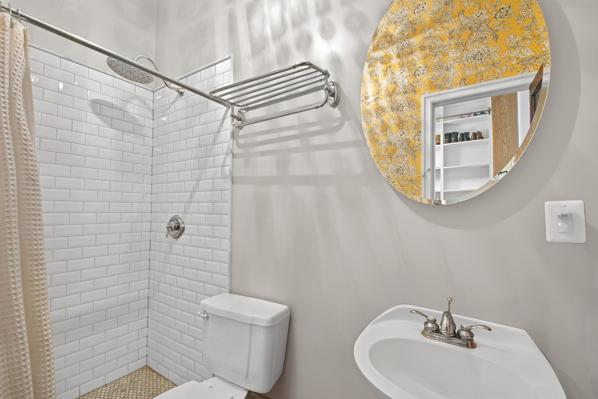 372 Dekalb Avenue, Unit 2H Brooklyn, NY 11205 - Photo 8 of 9 a bathroom with a sink a mirror and a shower