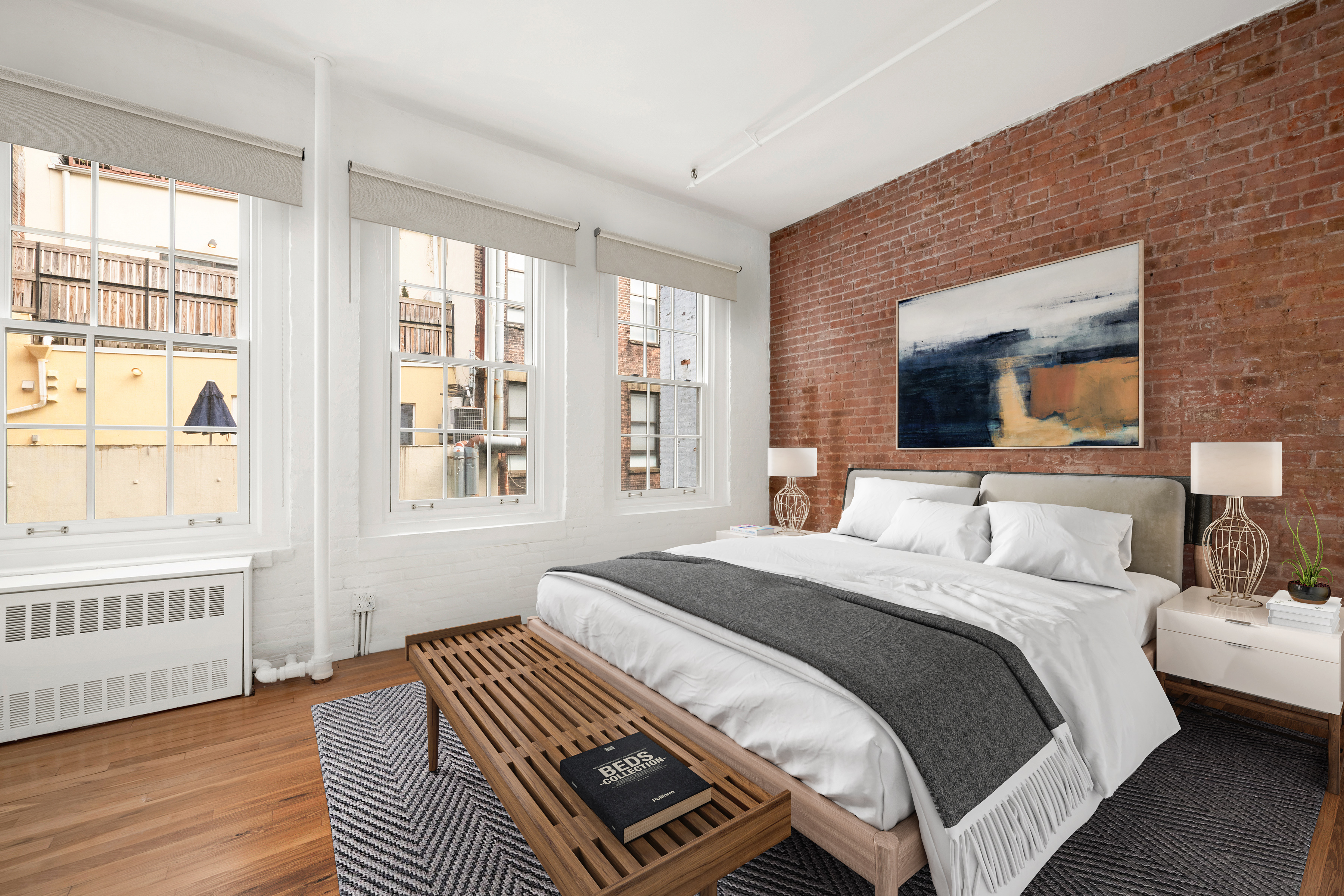 140 Thompson, Unit 4A Manhattan, NY 10012 - Photo 4 of 13 a bedroom with a bed wooden floor and a large window