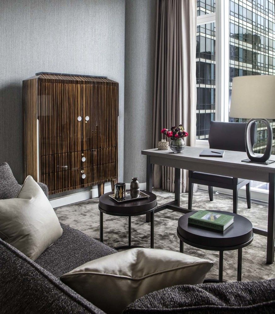 20 West 53rd Street, Unit 42A Manhattan, NY 10019 - Photo 22 of 31 a living room with furniture and a potted plant