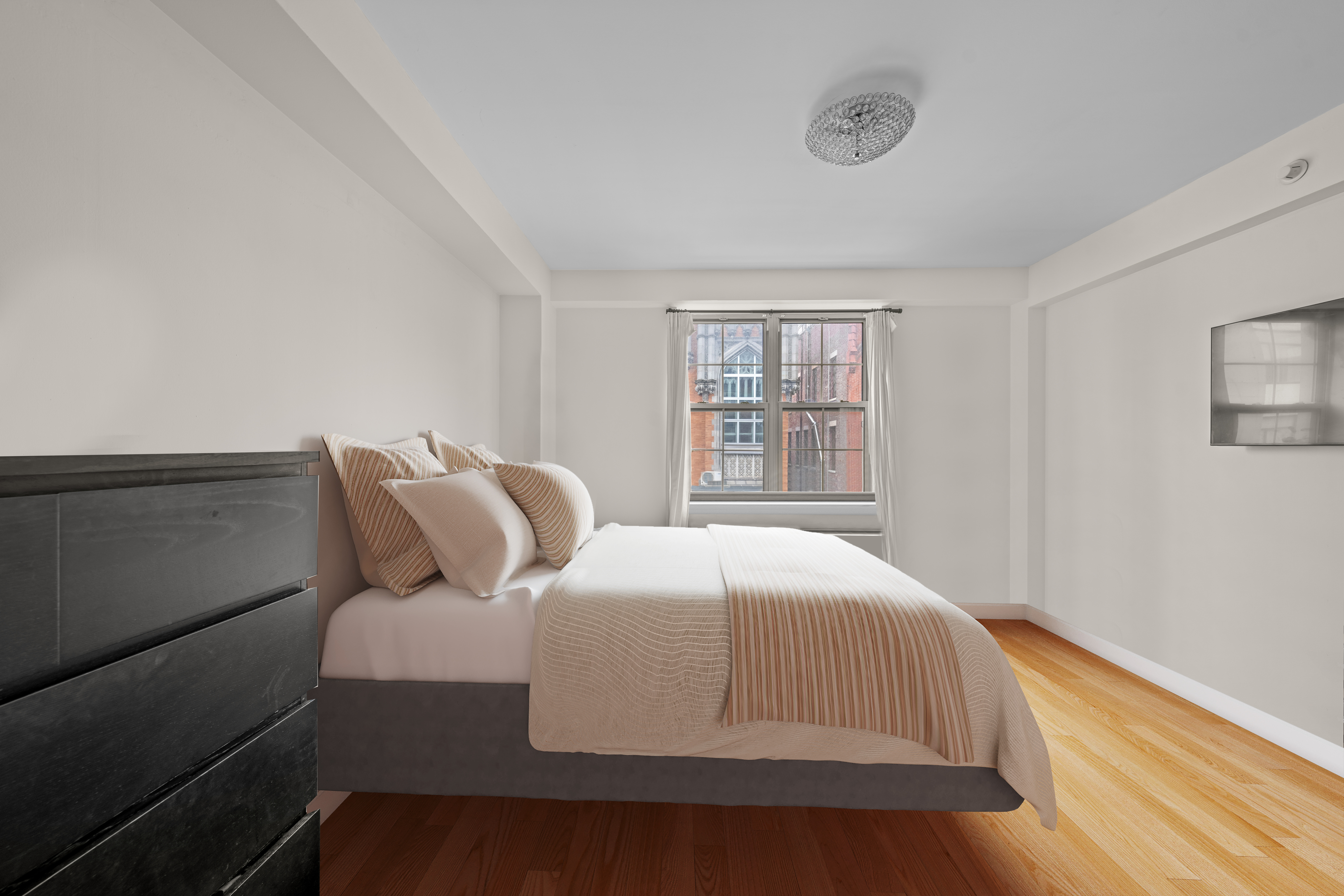 163 St Nicholas Avenue, Unit 4H Manhattan, NY 10026 - Photo 9 of 16 a bedroom with a bed and window