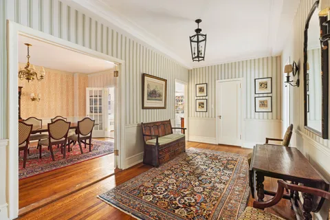 a view of a livingroom with furniture window and wooden floor
