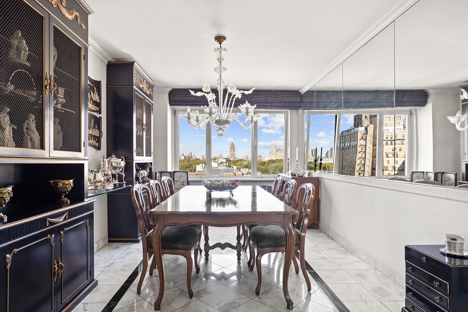 50 East 79th Street, Unit 12B Manhattan, NY 10075 - Photo 5 of 13 a view of a dining room with furniture window and outside view