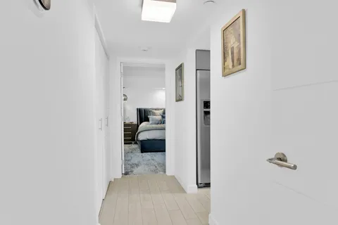 a bedroom with a bed and a view of bathroom