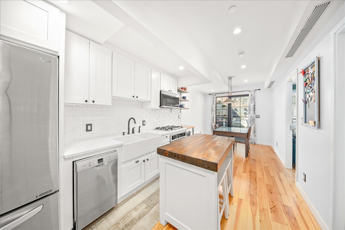 577 Madison Street, Unit 1B Brooklyn, NY 11221 - Photo 1 of 15 a view of a kitchen with electric appliances