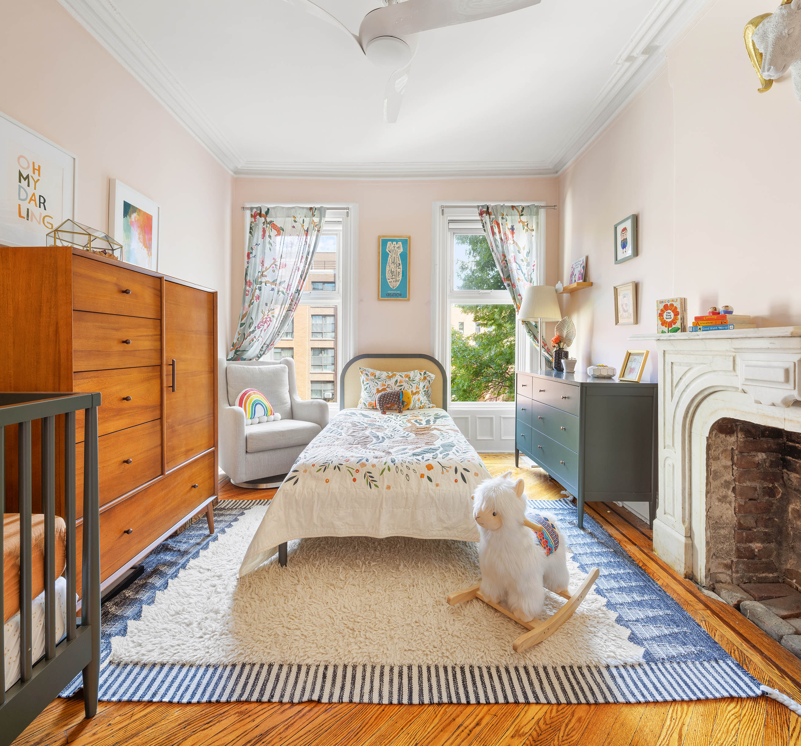 379 Monroe Street Brooklyn, NY 11221 - Photo 11 of 15 a living room with furniture and a fireplace
