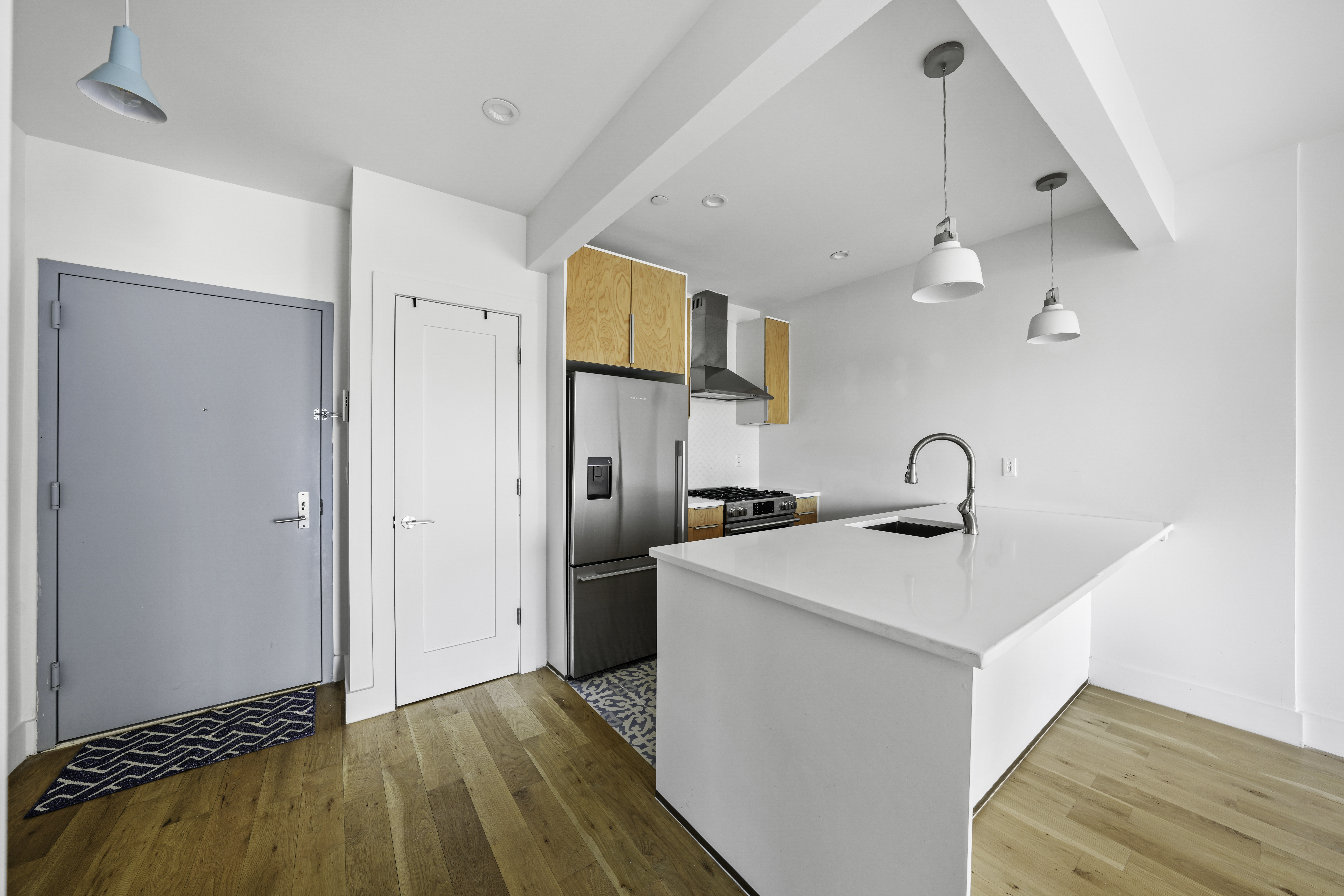 766 Decatur Street, Unit 4A Brooklyn, NY 11233 - Photo 7 of 12 a view of a kitchen with a sink and a refrigerator