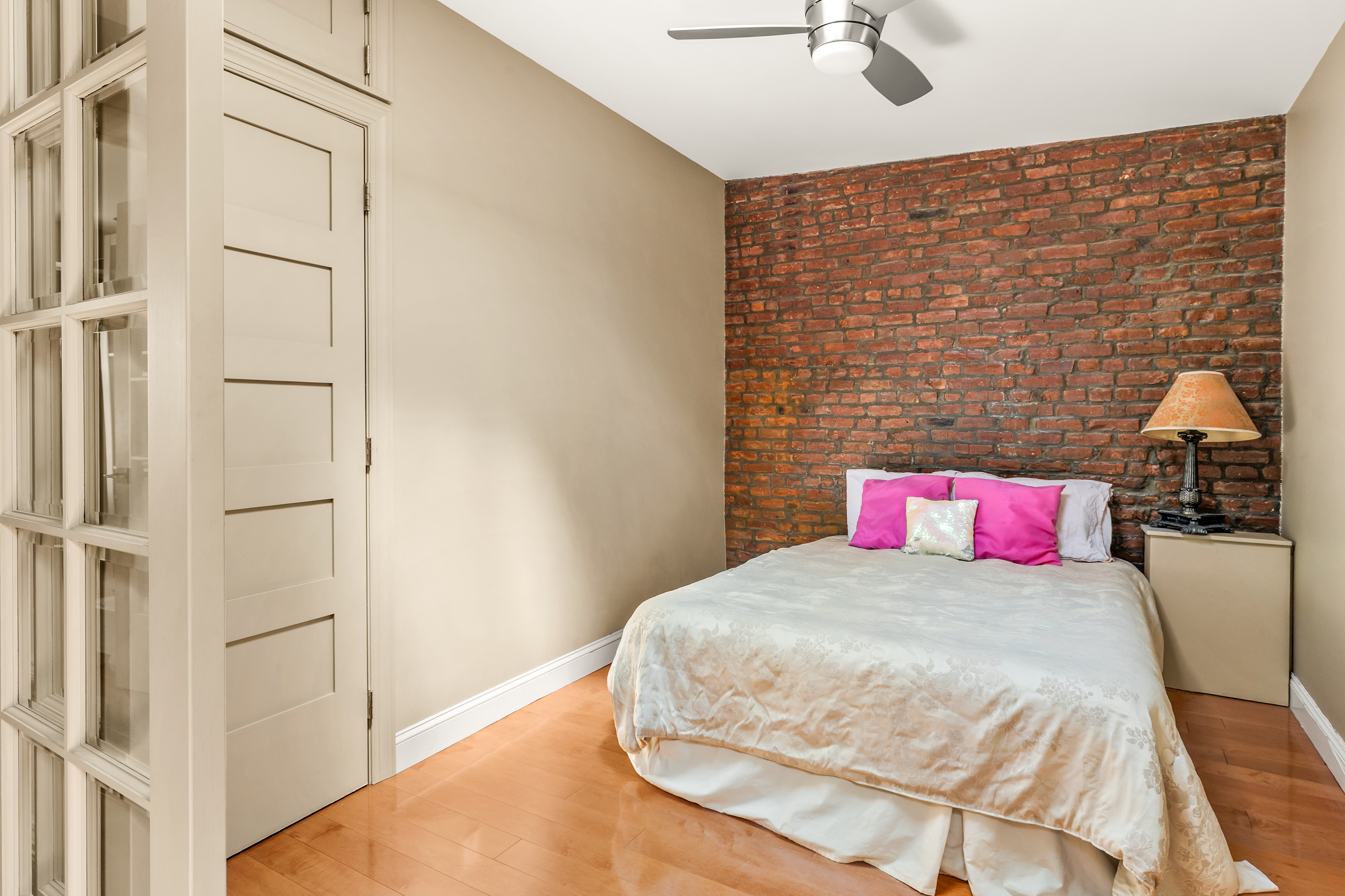 124 Carroll Street, Unit 2 Brooklyn, NY 11231 - Photo 6 of 13 a bedroom with a bed and a chandelier