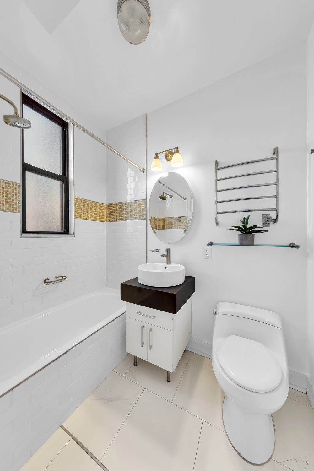 55 West 95th Street, Unit PHE Manhattan, NY 10025 - Photo 6 of 11 a bathroom with a sink a toilet and bathtub