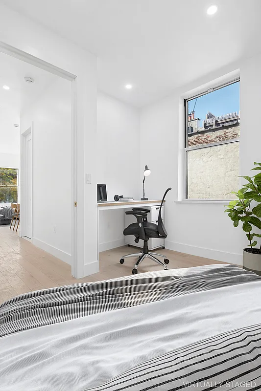 457 Bergen Street, Unit 2F Brooklyn, NY 11217 - Photo 11 of 12 a living room with furniture and a potted plant