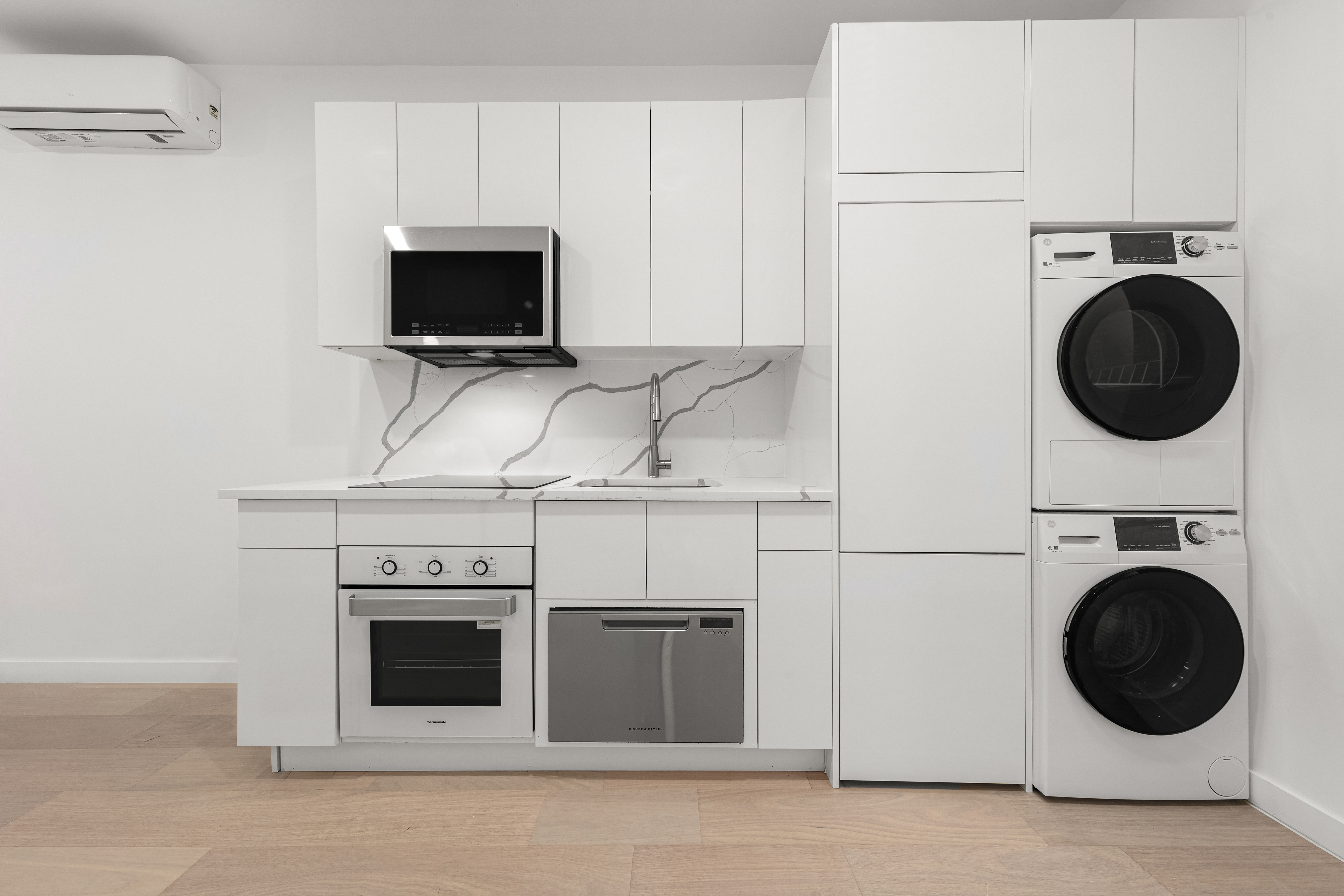 177 East 3rd Street, Unit 2A Manhattan, NY 10009 - Photo 2 of 8 a kitchen with a stove and a microwave