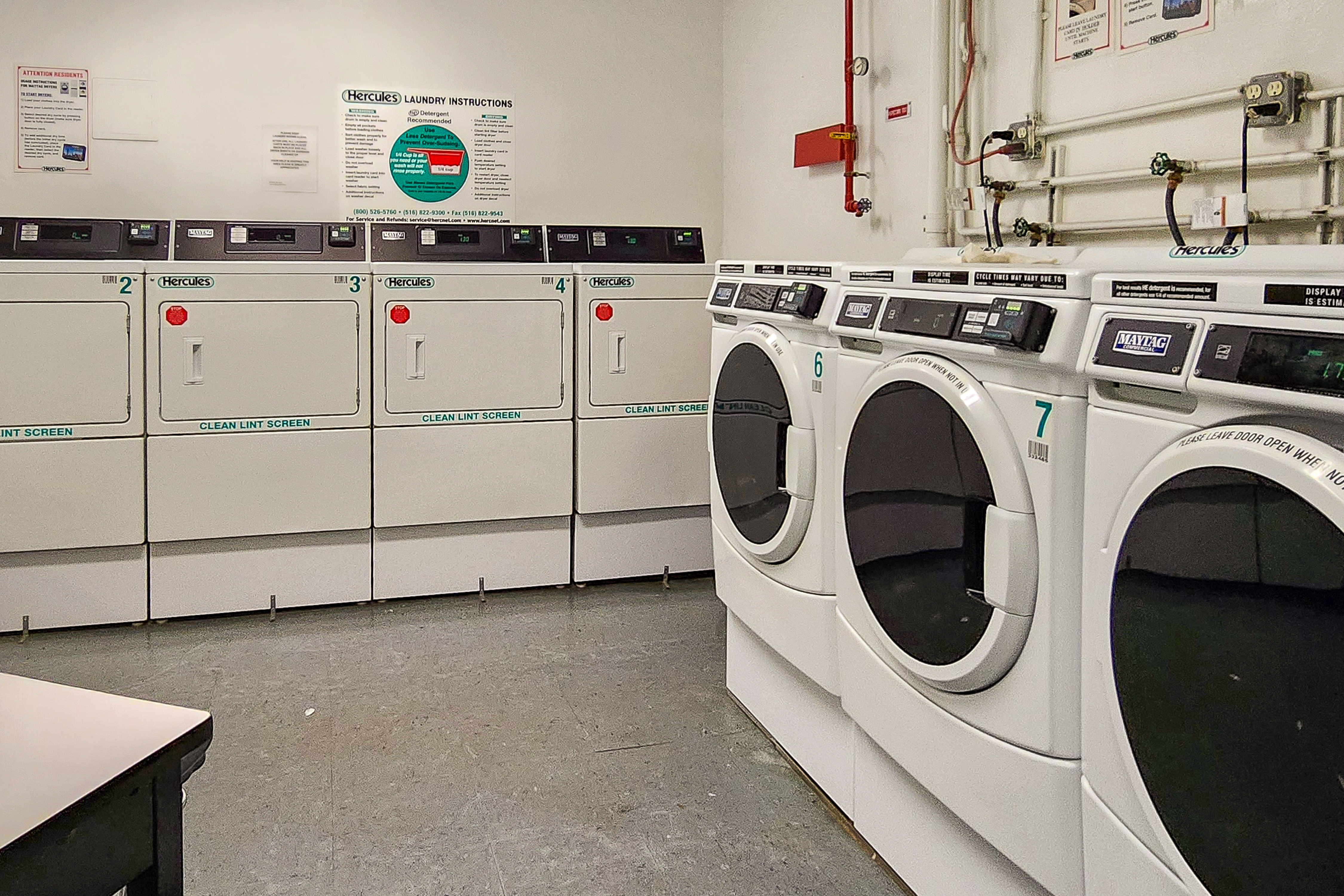 173-175 Riverside Drive, Unit 2L Manhattan, NY 10024 - Photo 14 of 18 a utility room with dryer and washer