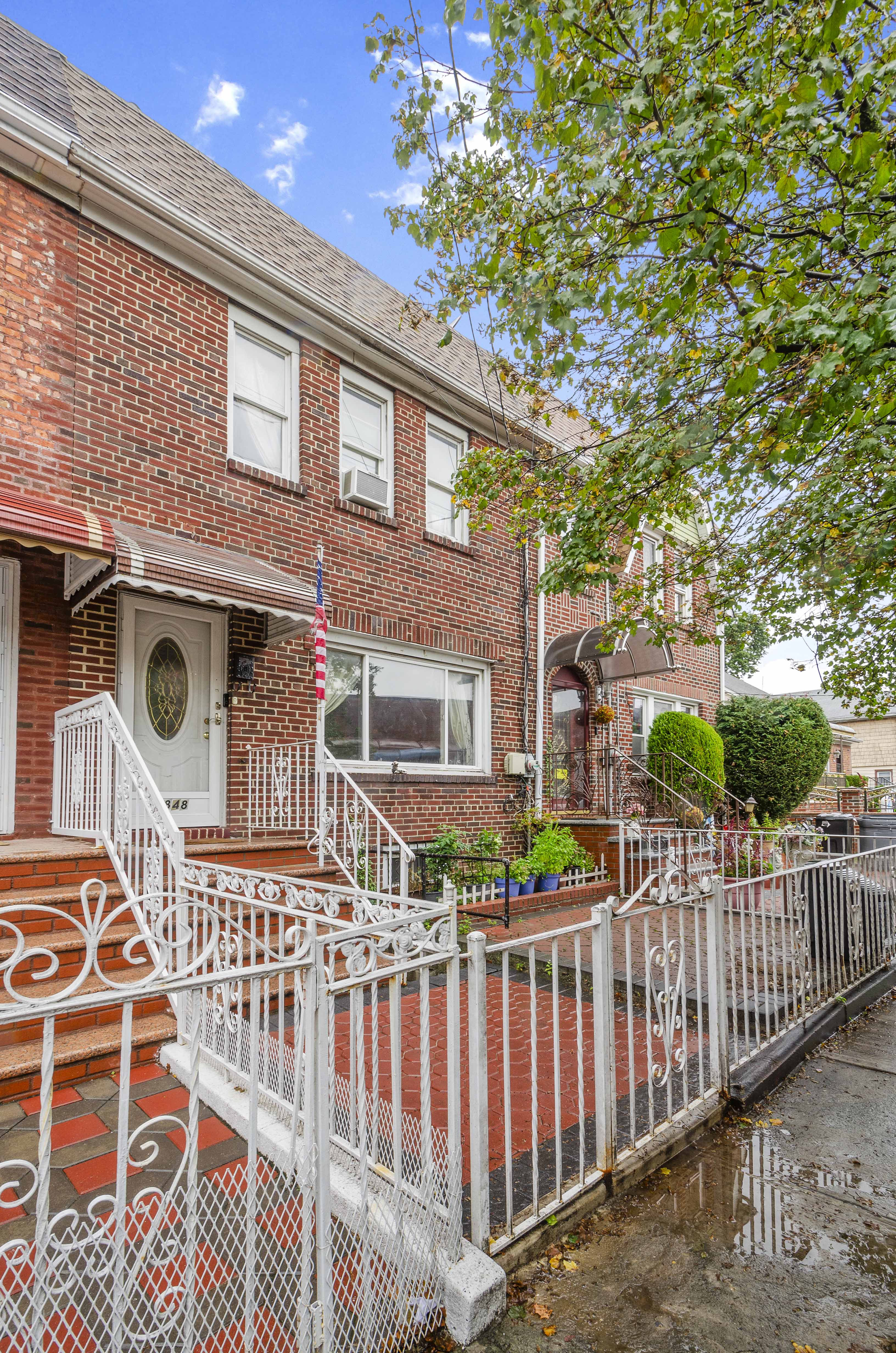 1848 East 49th Street Brooklyn, NY 11234 - Photo 6 of 7 a front view of a house with a porch