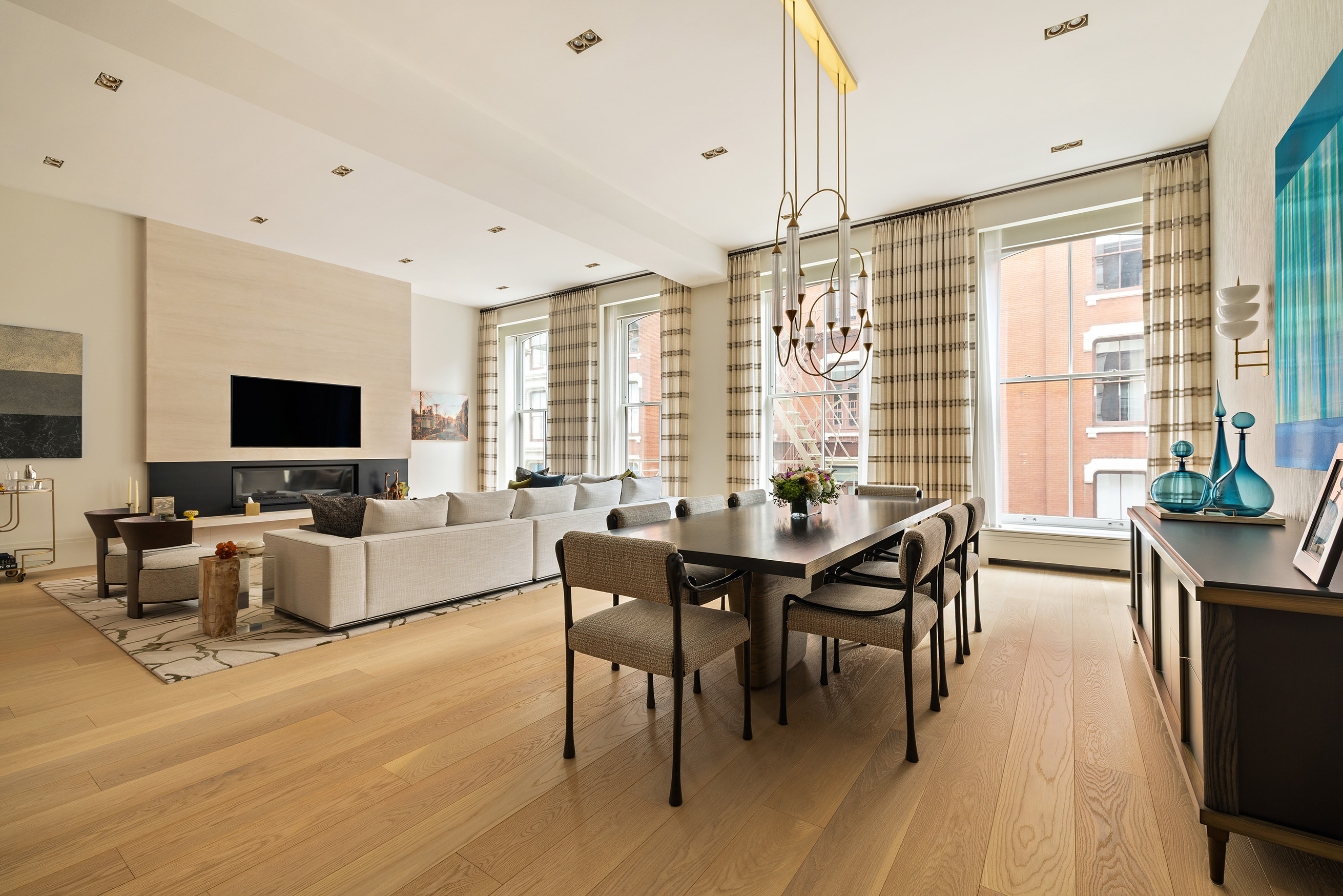 53 Greene Street, Unit 3 Manhattan, NY 10013 - Photo 3 of 22 a view of a dining room with furniture window and wooden floor