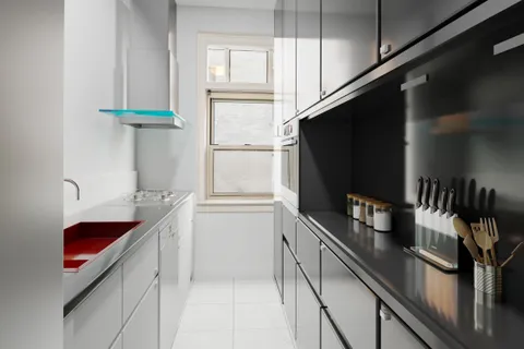 a kitchen with stainless steel appliances a sink and a refrigerator