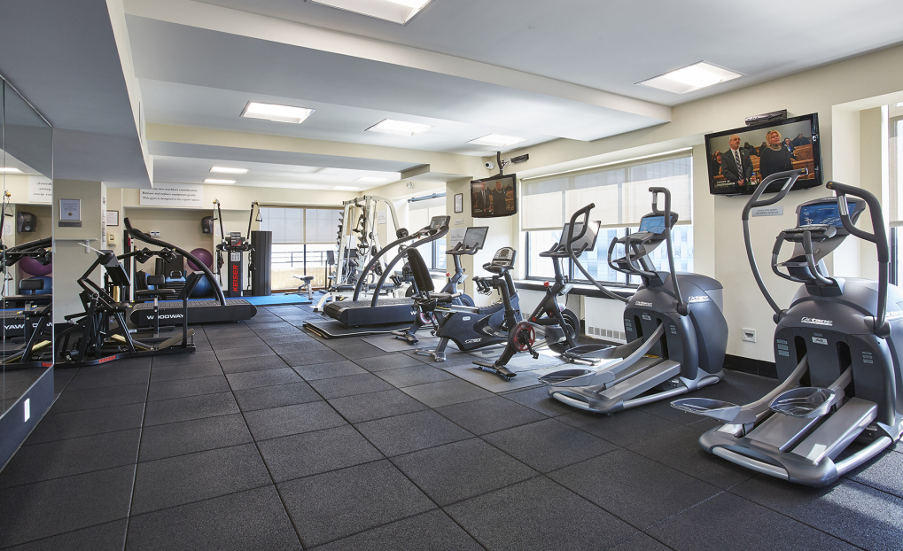 400 East 70th Street, Unit 1008 Manhattan, NY 10021 - Photo 9 of 15 a view of a room with gym equipment