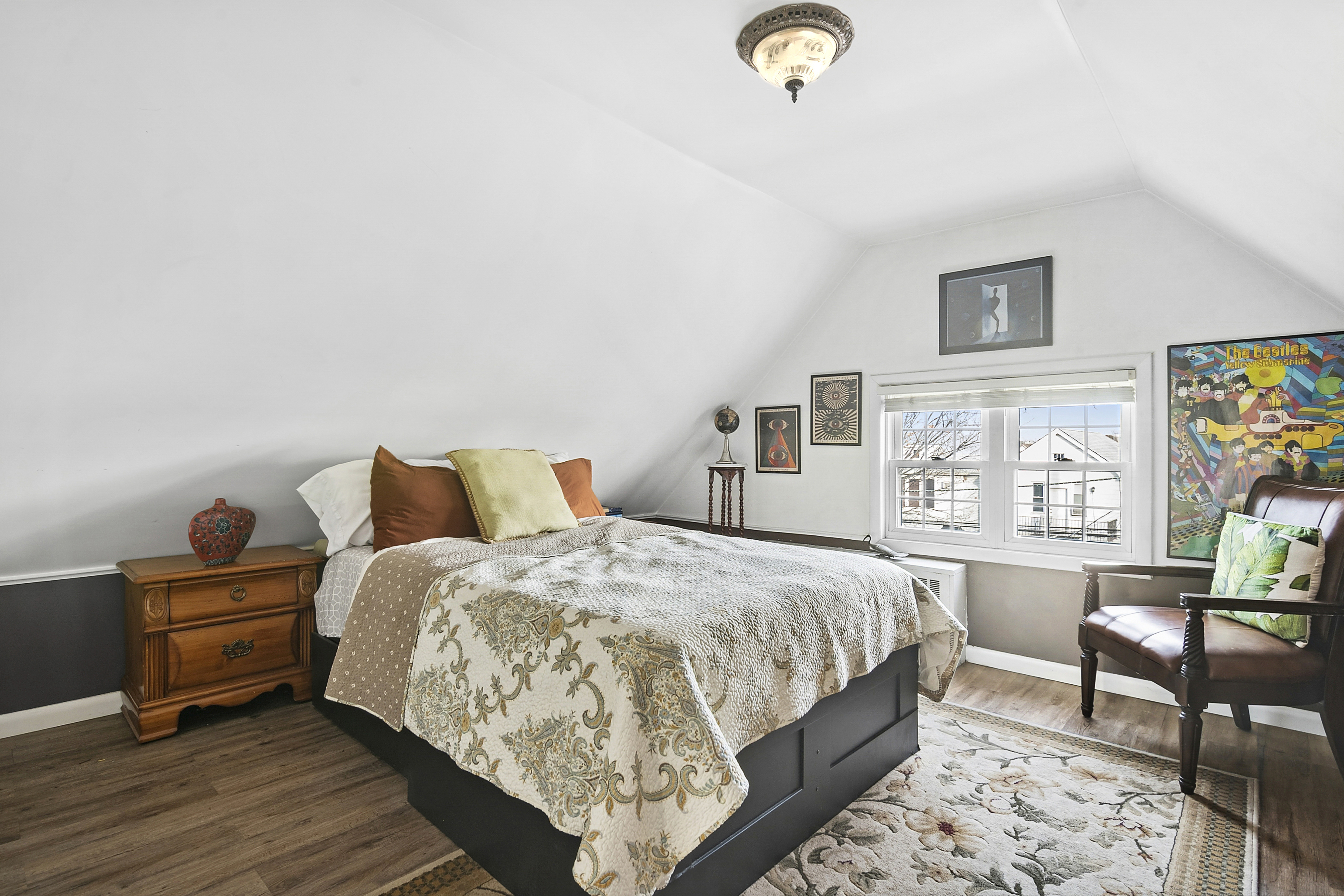 1384 East 29th Street Brooklyn, NY 11210 - Photo 10 of 21 a bedroom with bed and wooden floor