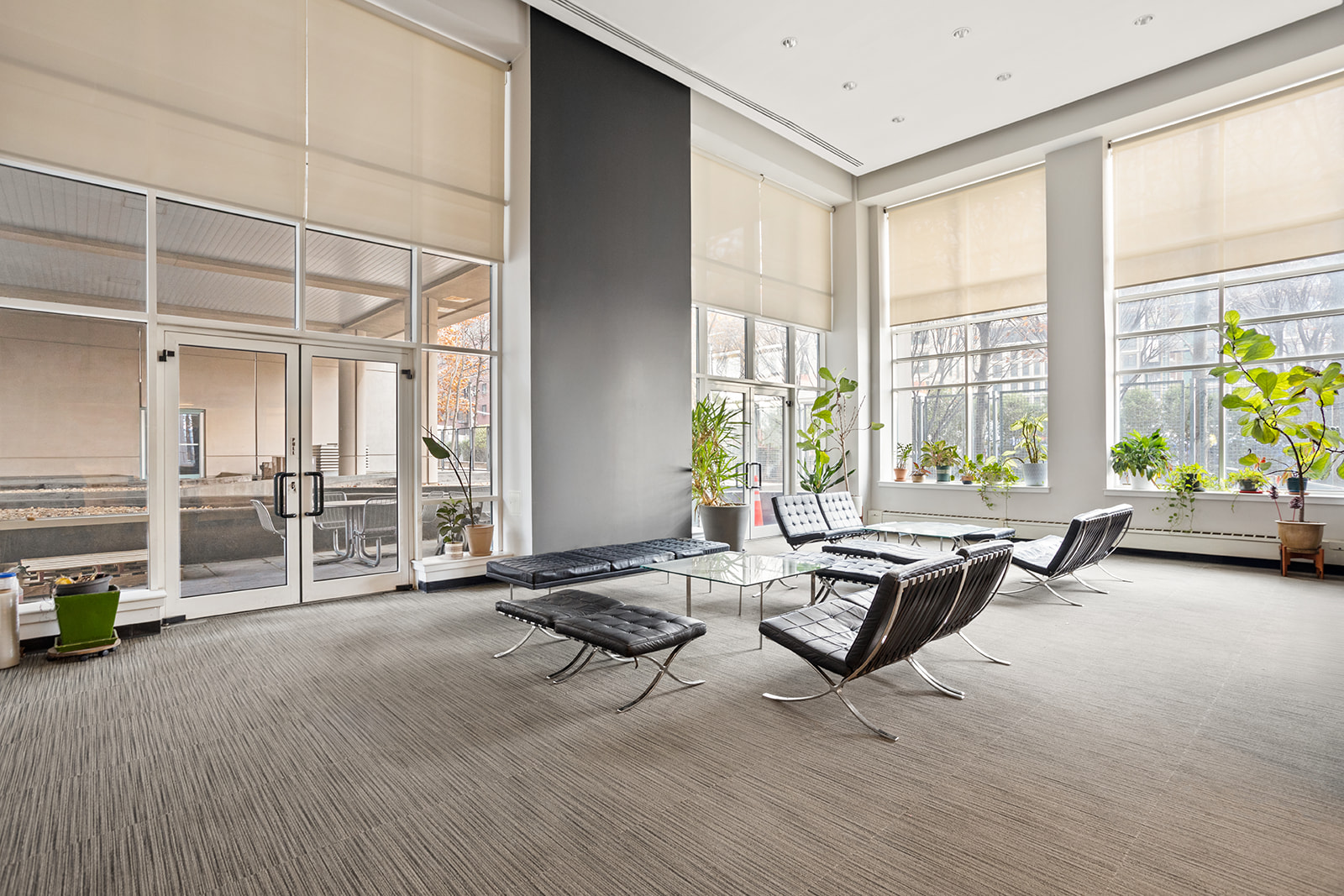440 Kent Avenue, Unit F18 Brooklyn, NY 11249 - Photo 13 of 16 a living room with furniture and large windows