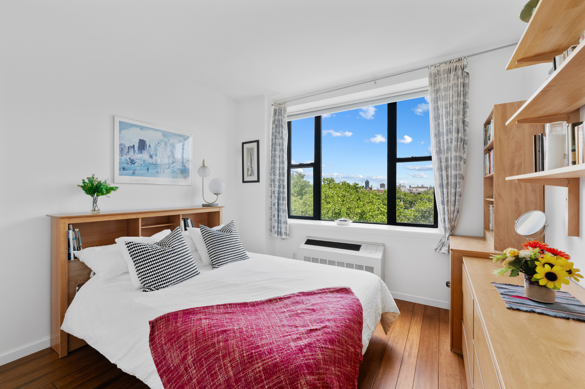 504 West 136th Street, Unit 6A Manhattan, NY 10031 - Photo 2 of 10 a bed sitting in a bedroom next to a window