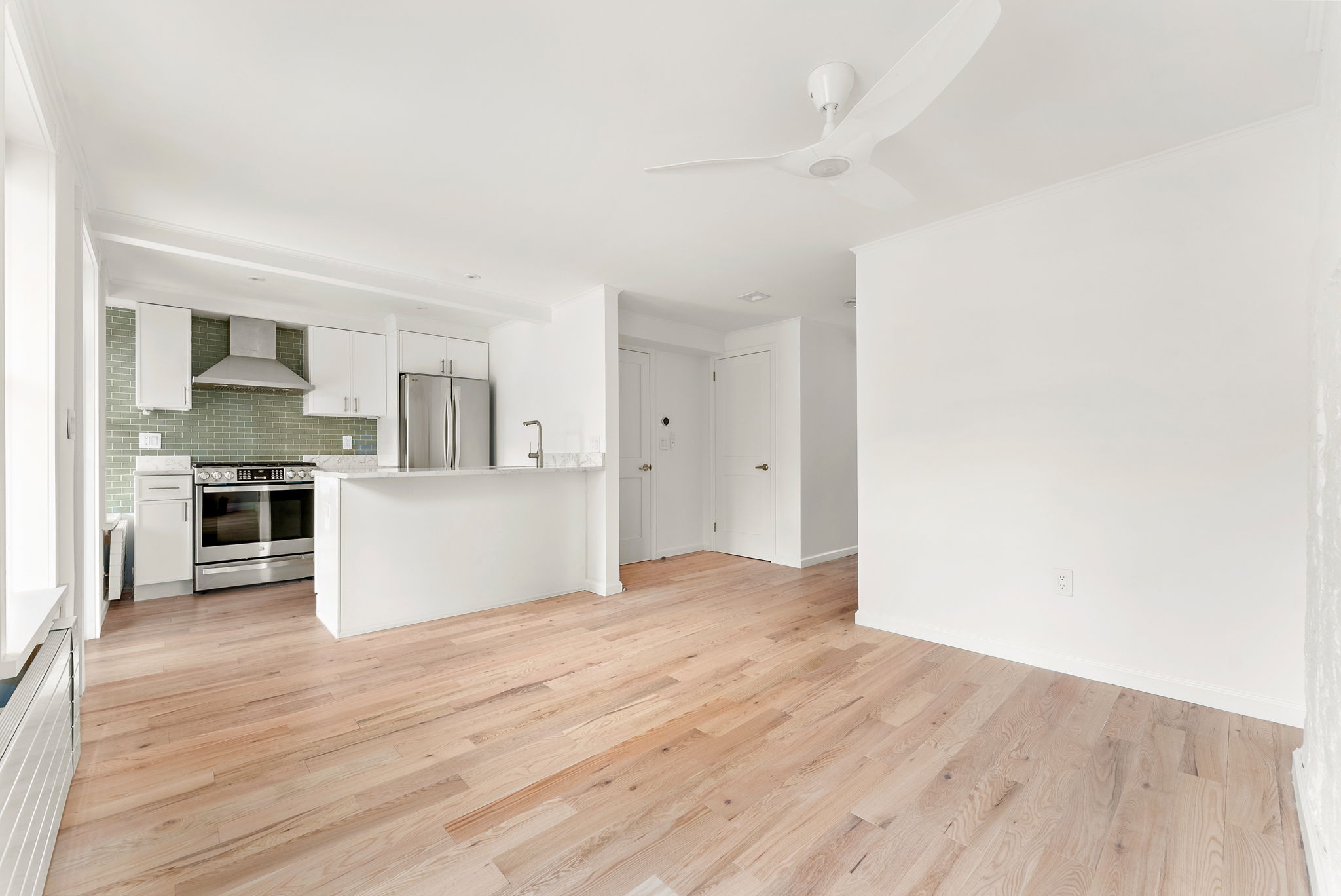 54 East 4th Street, Unit 1 Brooklyn, NY 11218 - Photo 1 of 12 a view of kitchen with wooden floor