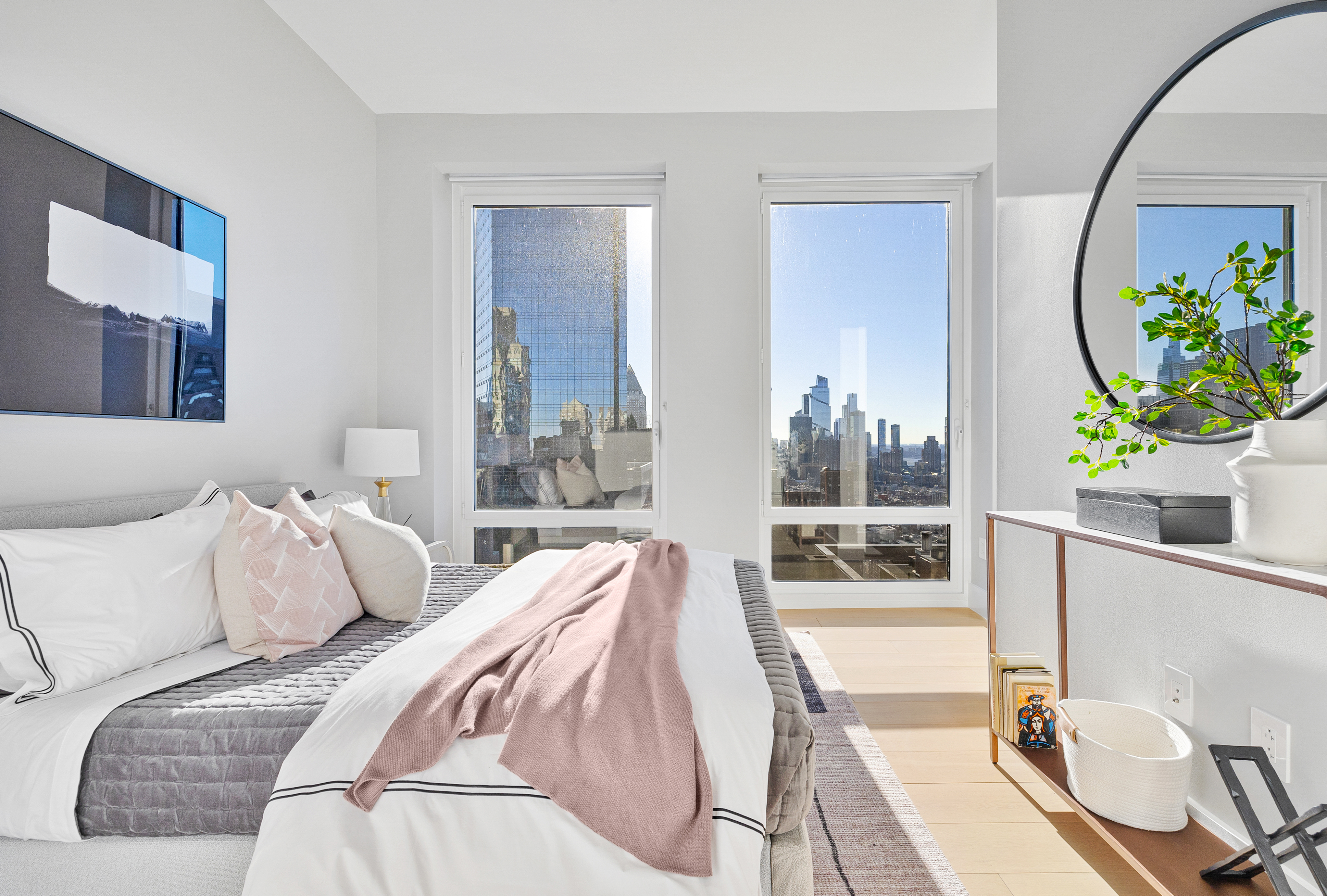 15 West 61st Street, Unit PH1C Manhattan, NY 10023 - Photo 12 of 26 a bedroom with a bed and a potted plant