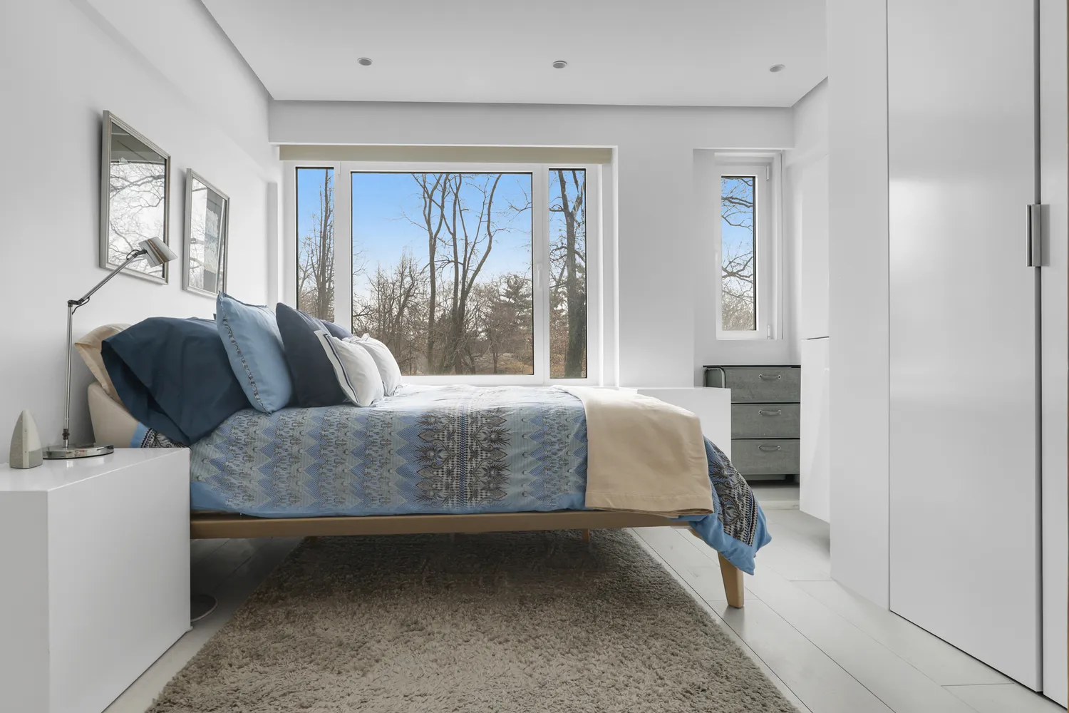 a bedroom with a bed and window