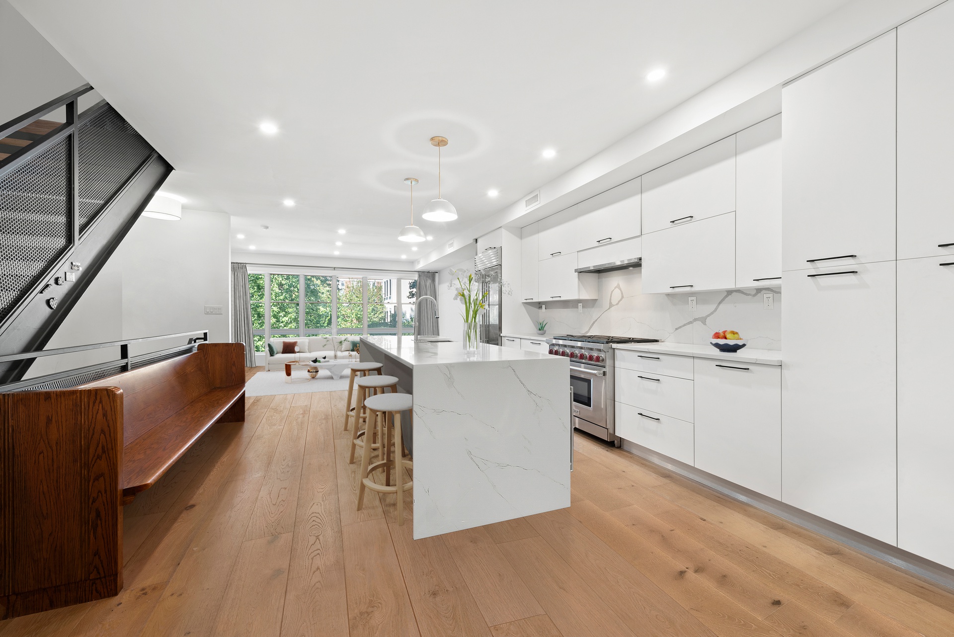 65 Bainbridge Street Brooklyn, NY 11233 - Photo 4 of 24 a kitchen with stainless steel appliances granite countertop a stove top oven a sink a refrigerator and white cabinets with wooden floor
