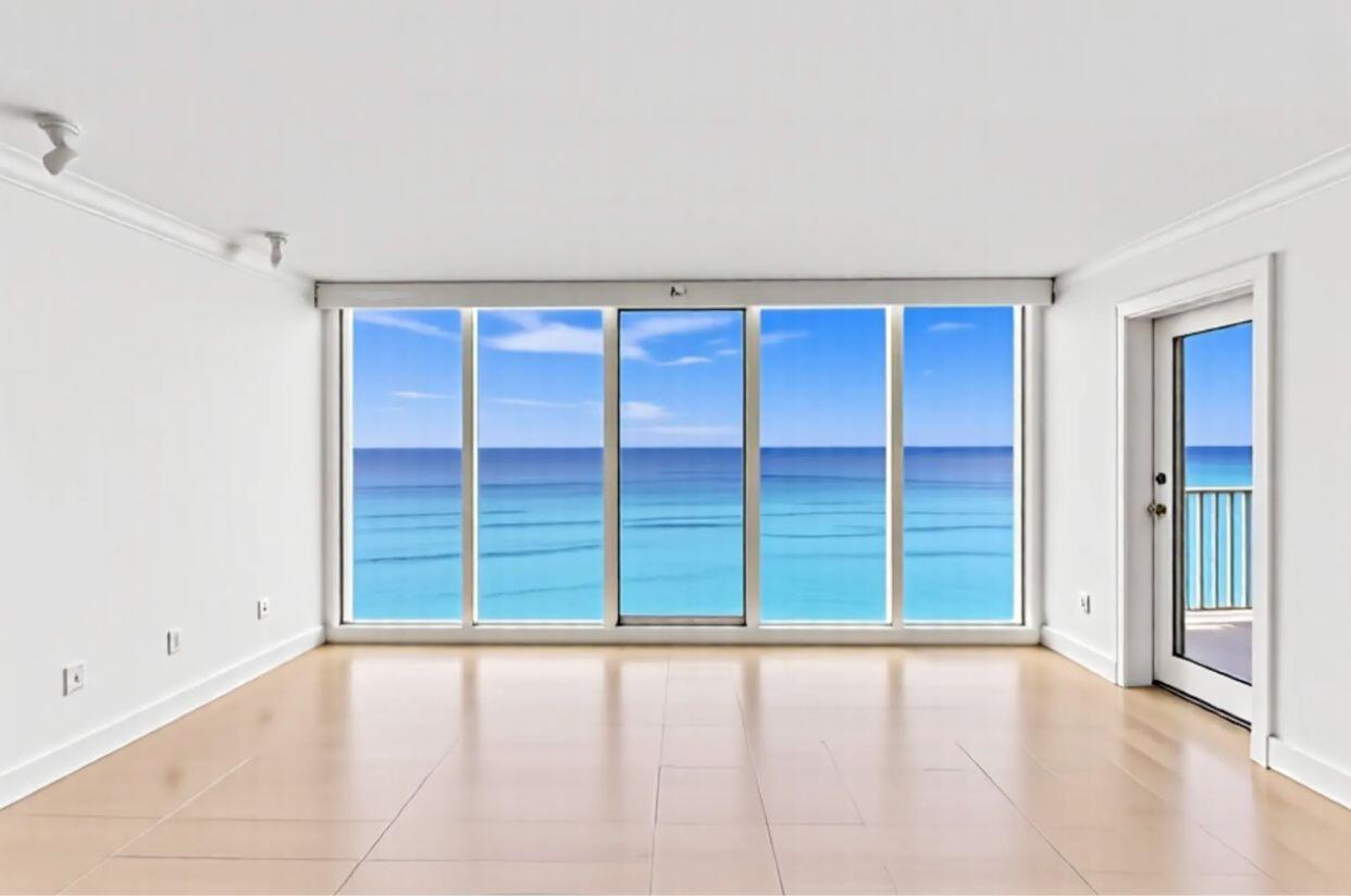 3000 South Ocean Boulevard, Unit 1504 Boca Raton, FL 33432 - Photo 4 of 64 wooden floor and window in an empty room