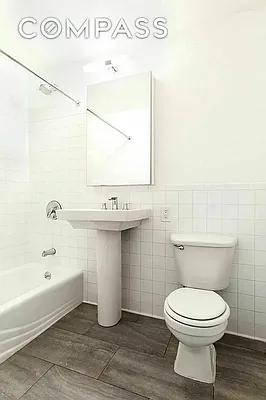 204 Huntington Street, Unit 3I Brooklyn, NY 11231 - Photo 4 of 5 a bathroom with a toilet sink and mirror