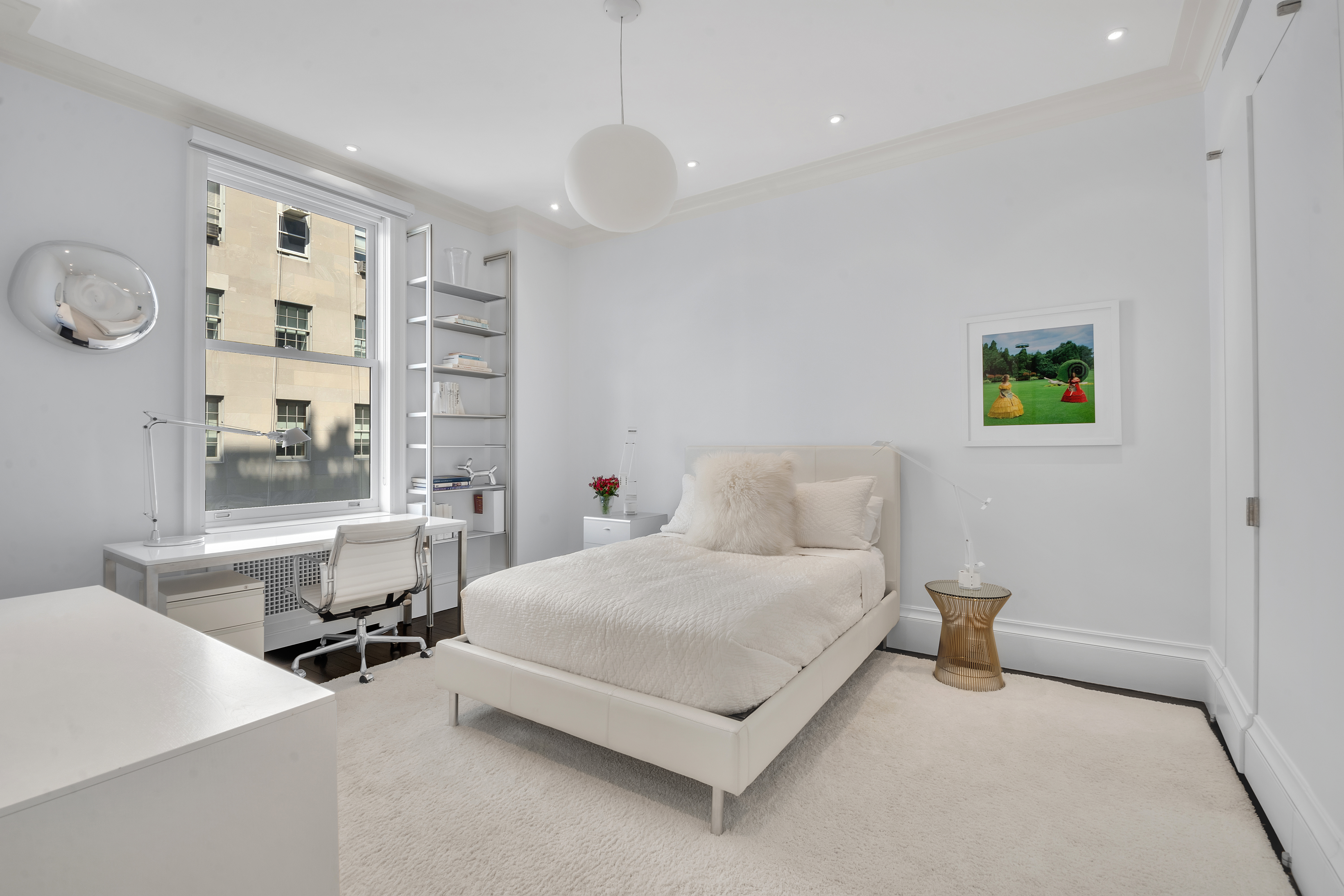 988 5th Avenue Manhattan, NY 10075 - Photo 13 of 14 a bedroom with a bed and window