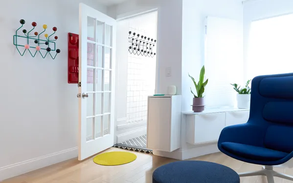 a living room with furniture rug and wooden floor