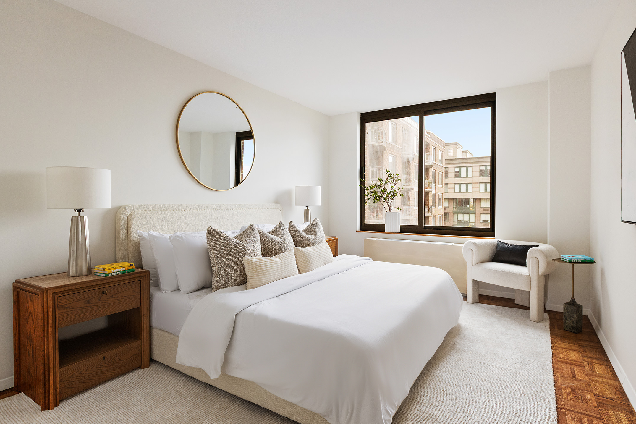 2 South End Avenue, Unit 7B Manhattan, NY 10280 - Photo 6 of 17 a bedroom with bed and a window