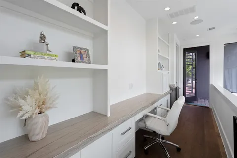 a view of workspace with wooden floor