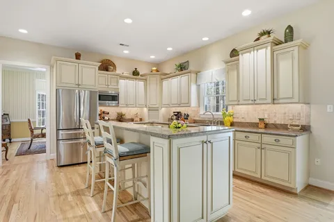 a kitchen with sink and cabinets