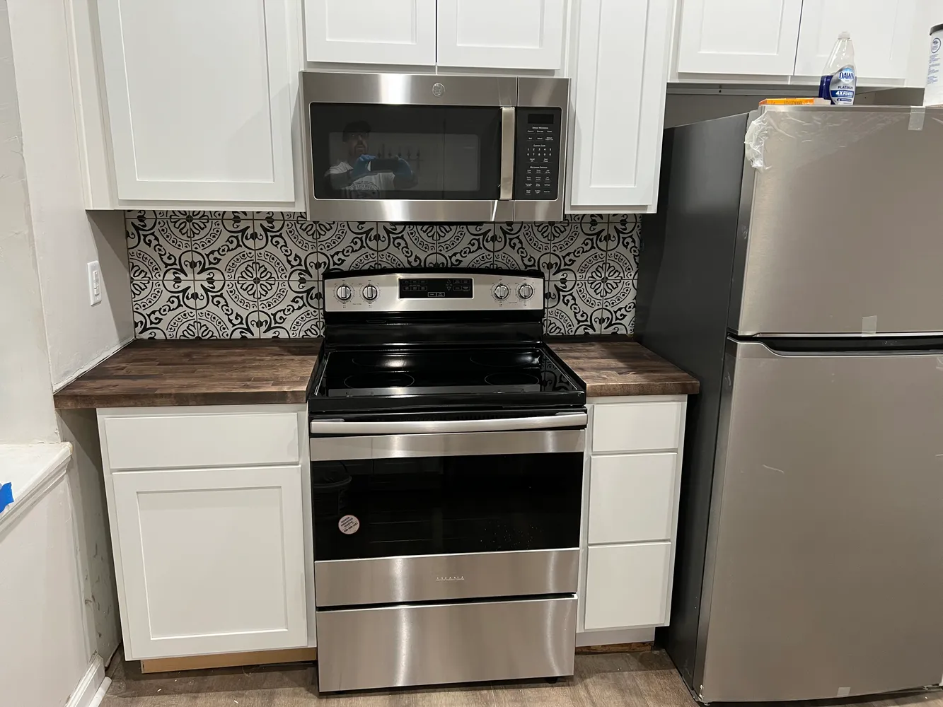 a kitchen with a stove and a microwave