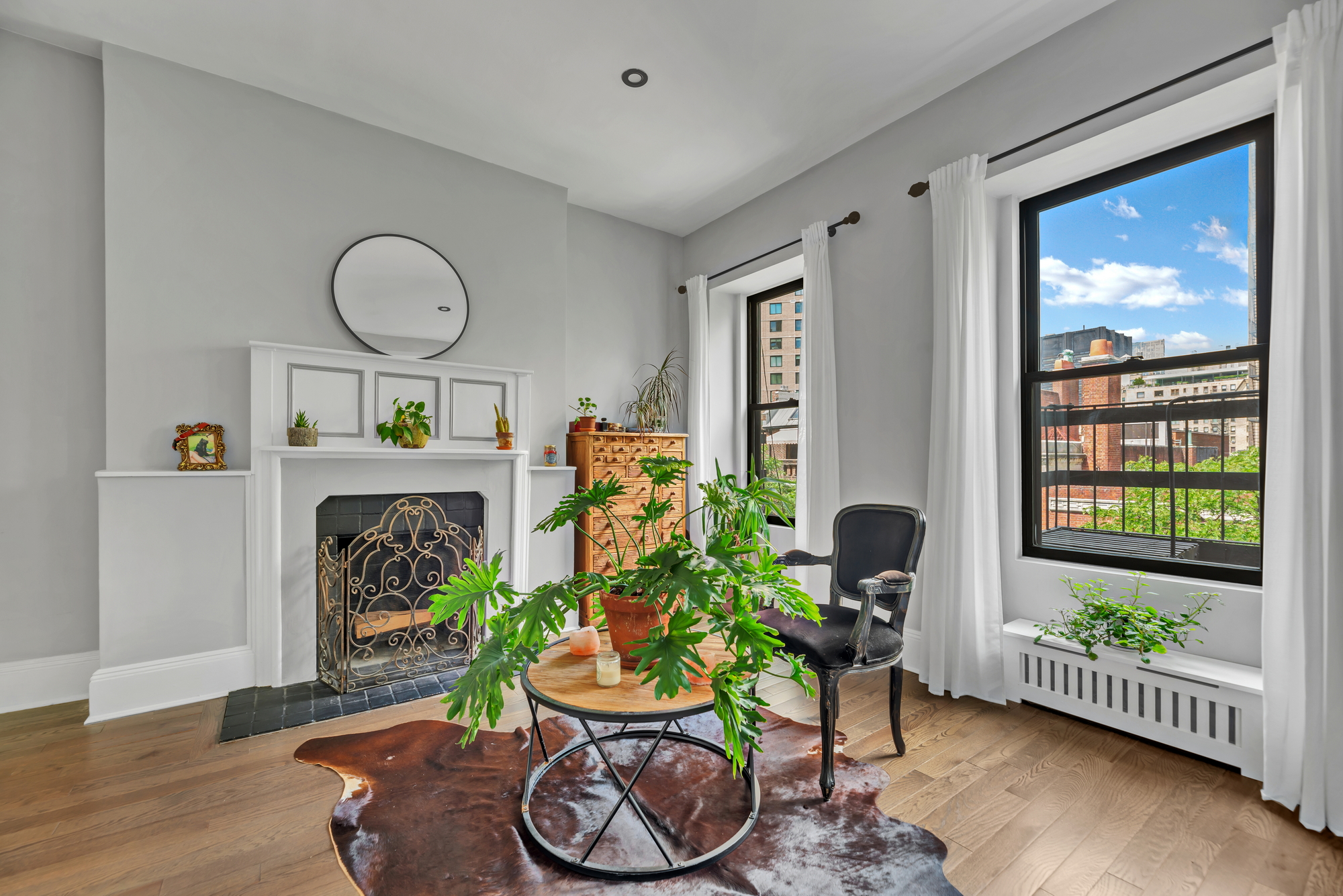 72 East 93rd Street, Unit 5 Manhattan, NY 10128 - Photo 8 of 17 a living room with furniture fireplace and a window