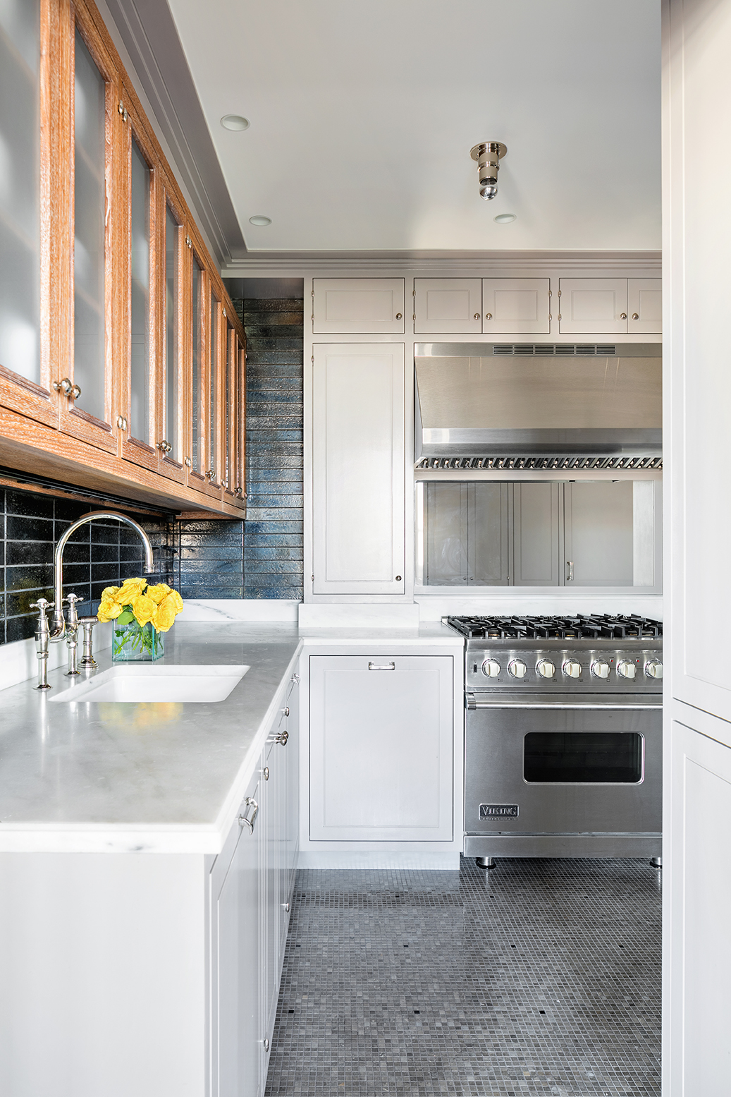 136 Waverly Place, Unit 17BC Manhattan, NY 10014 - Photo 6 of 14 a kitchen with a stove a sink and a refrigerator