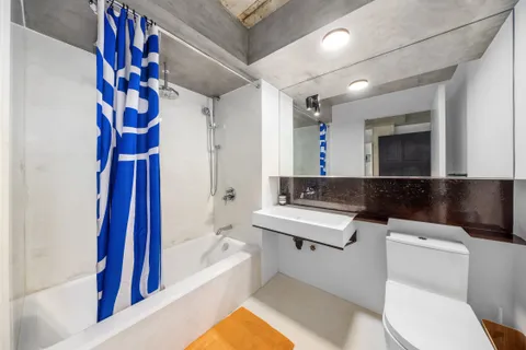 a bathroom with a sink a toilet and a bathtub