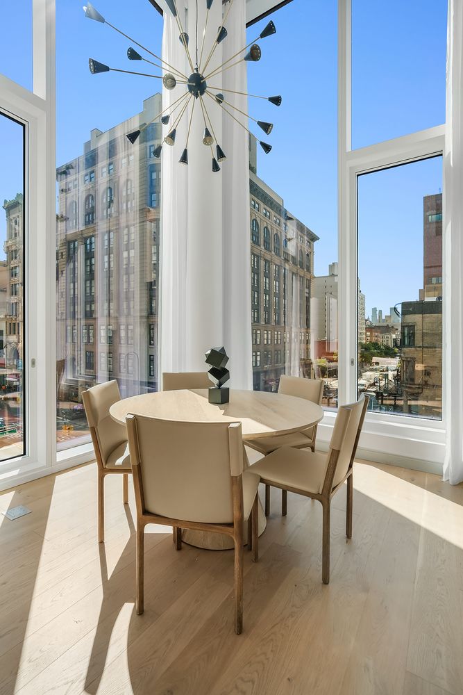 a dining room with furniture and window