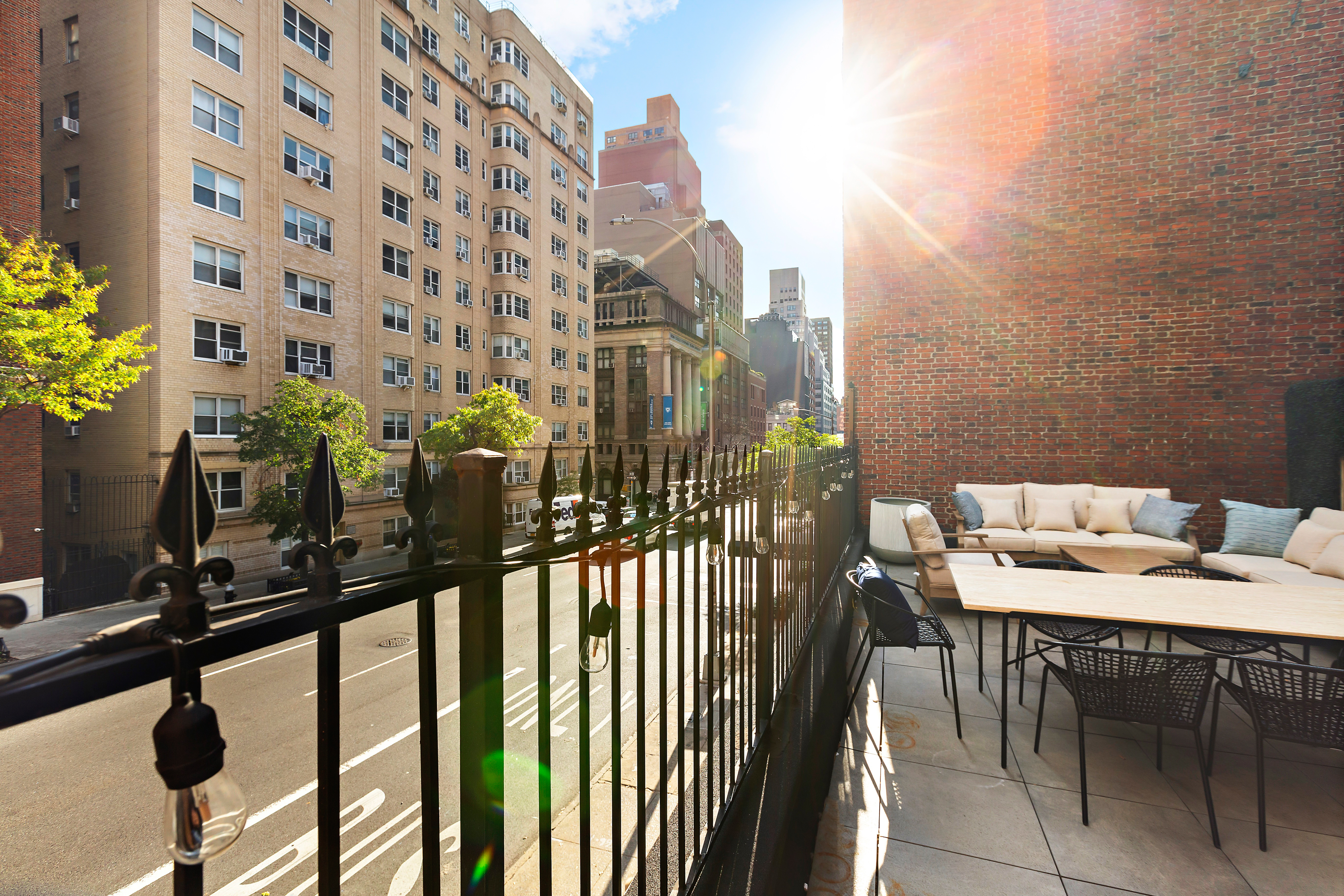 134 East 36th Street Manhattan, NY 10016 - Photo 7 of 28 a table and chairs in the balcony