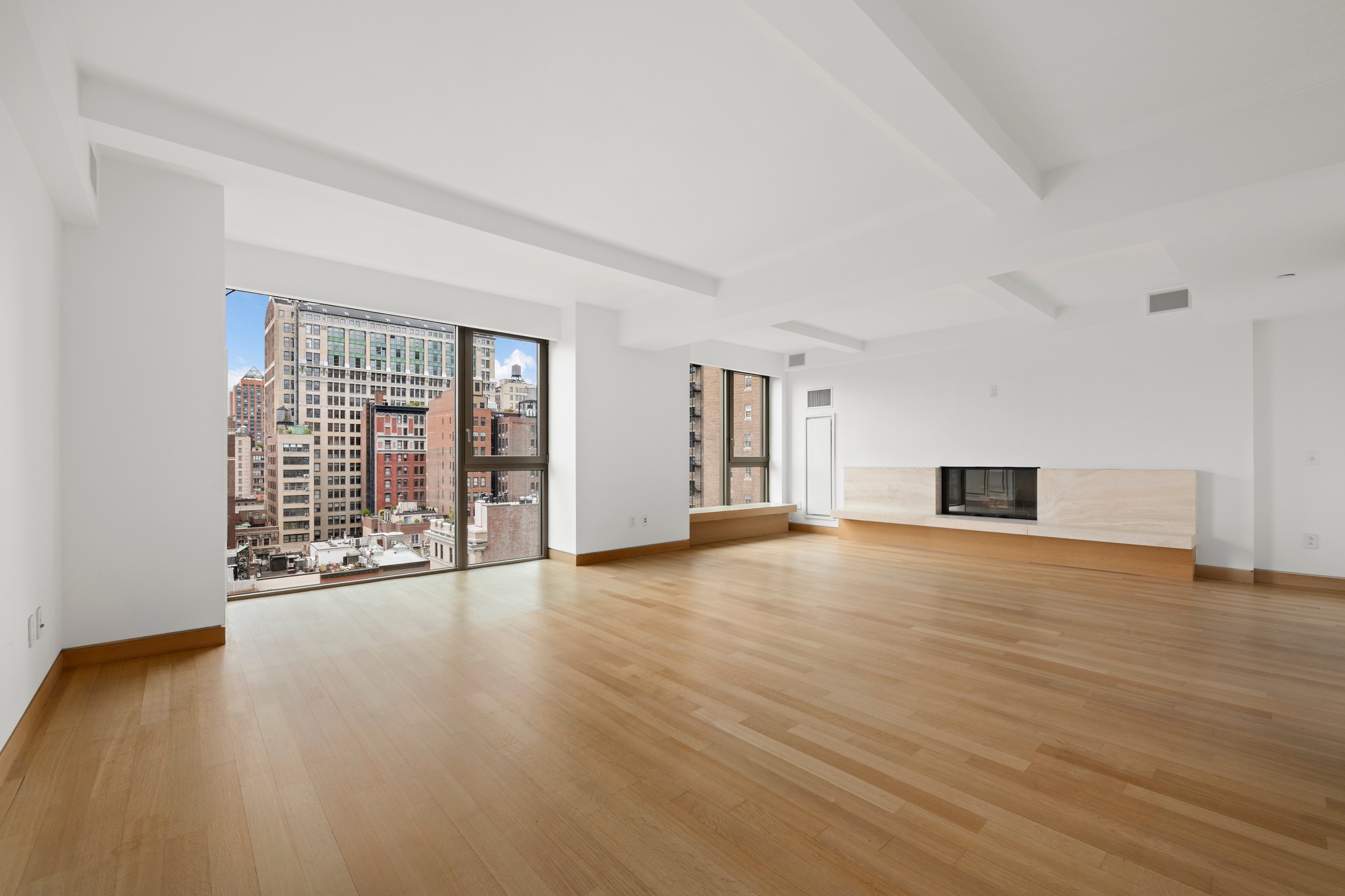 50 Gramercy Park North, Unit 15A Manhattan, NY 10010 - Photo 19 of 29 a view of an empty room with wooden floor and a window