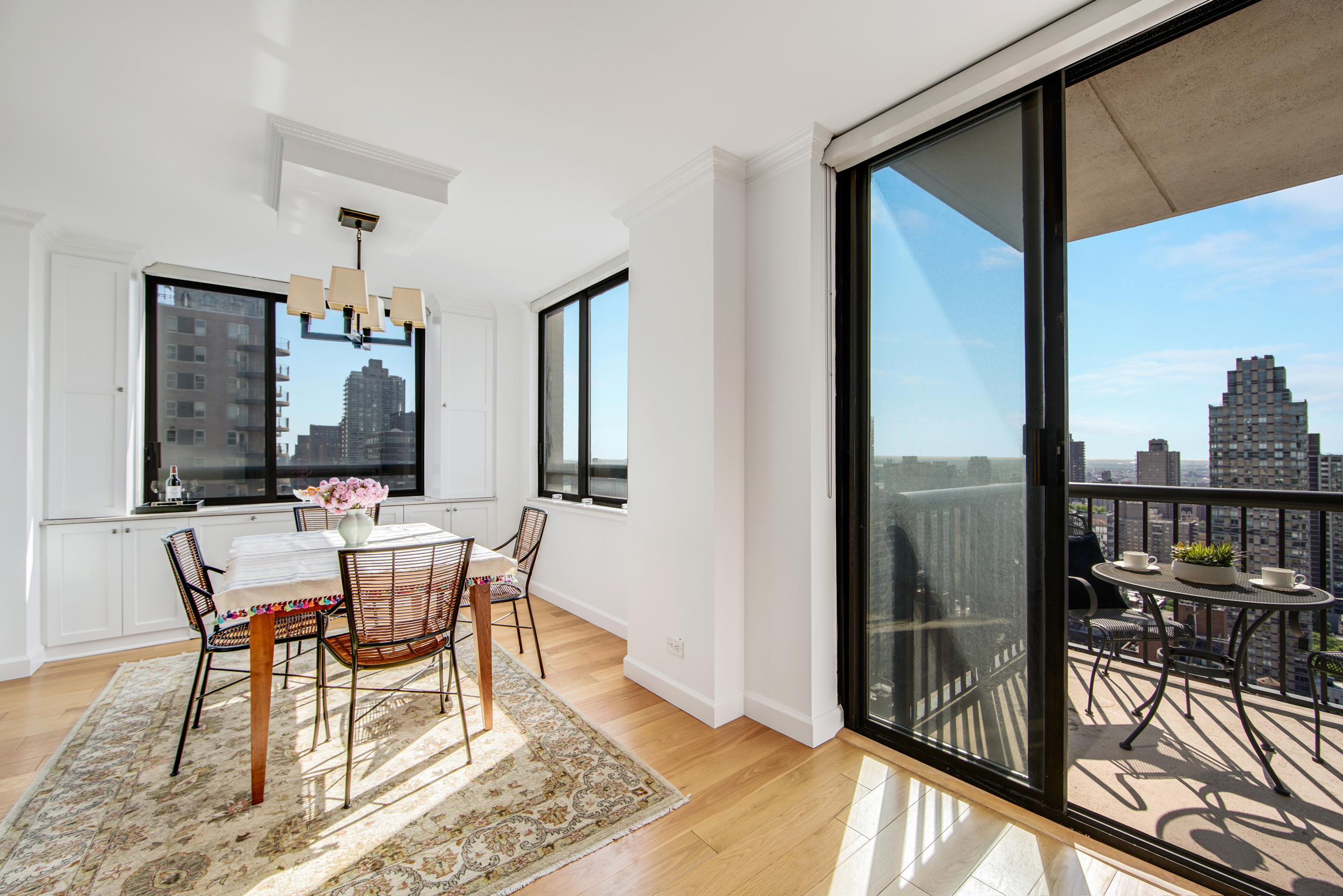 171 East 84th Street, Unit 31C Manhattan, NY 10028 - Photo 4 of 18 a view of a dining room with furniture window and outside view